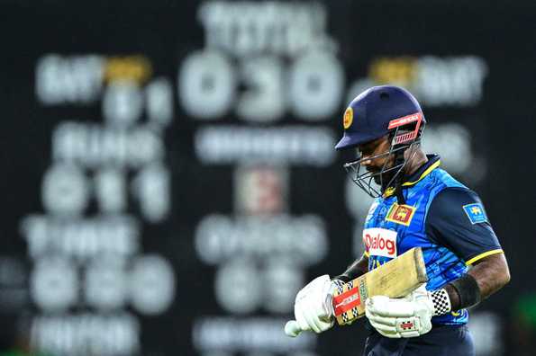 Charith Asalanka walks back after being dismissed in the second T20I